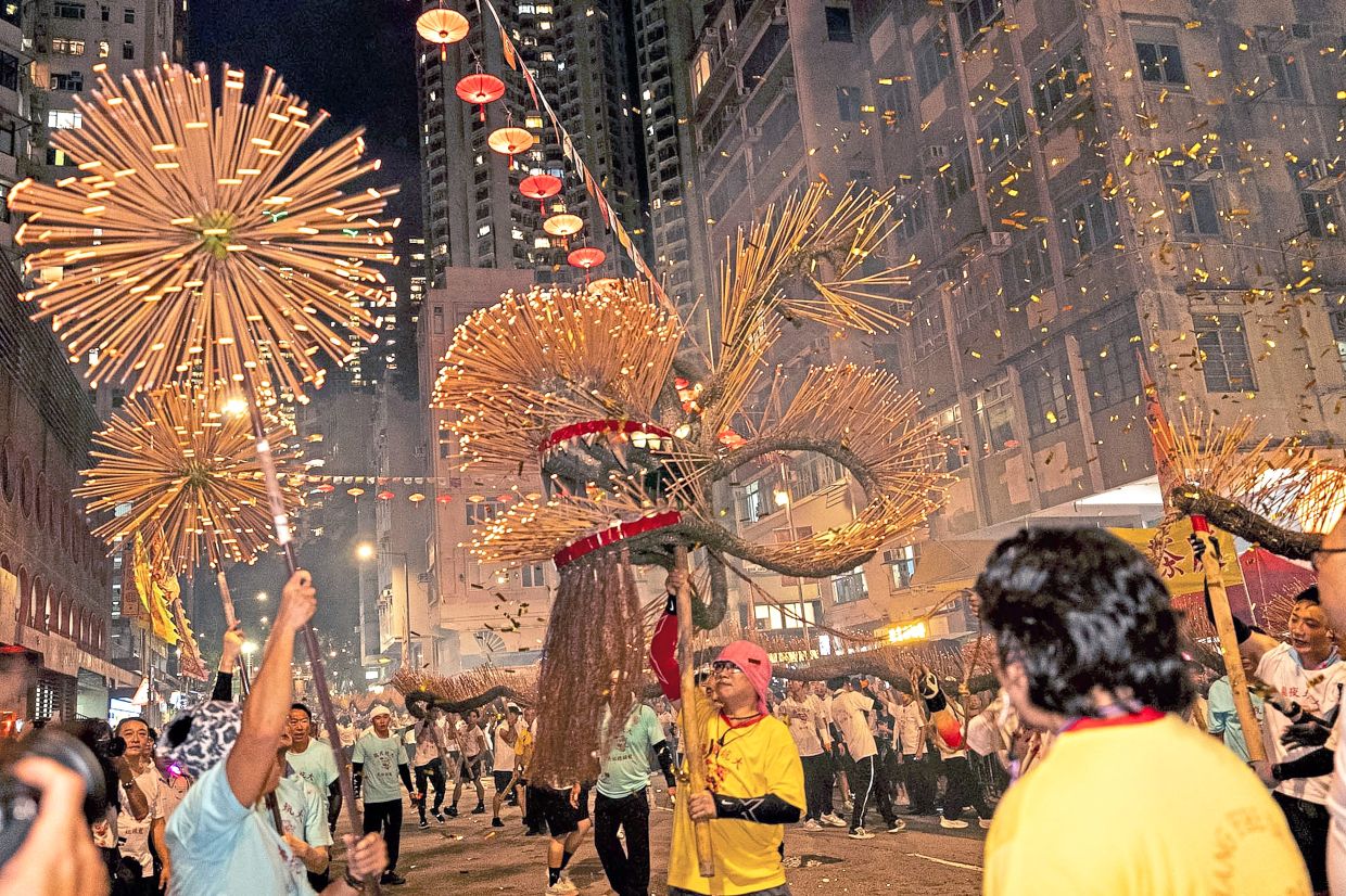99. A straw fire dragon studded with incense sticks is paraded during the Tai Hang Fire Dragon Dance in Hong Kong as part of Mid-Autumn Festival celebrations. The centuries-old tradition is one of the city’s signature festivities, with the illuminated dragon carried through the streets to the beat of drums. — AP