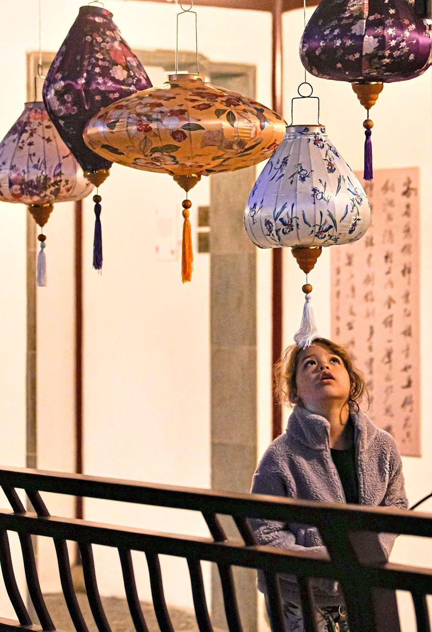 1. A child looking up at lanterns during a Chinese Mid-Autumn Festival celebration in Vancouver, British Columbia, Canada. Traditionally observed on the 15th day of the eighth month of the lunar calendar, the festival is marked by lanterns, mooncakes and family gatherings. — Xinhua
