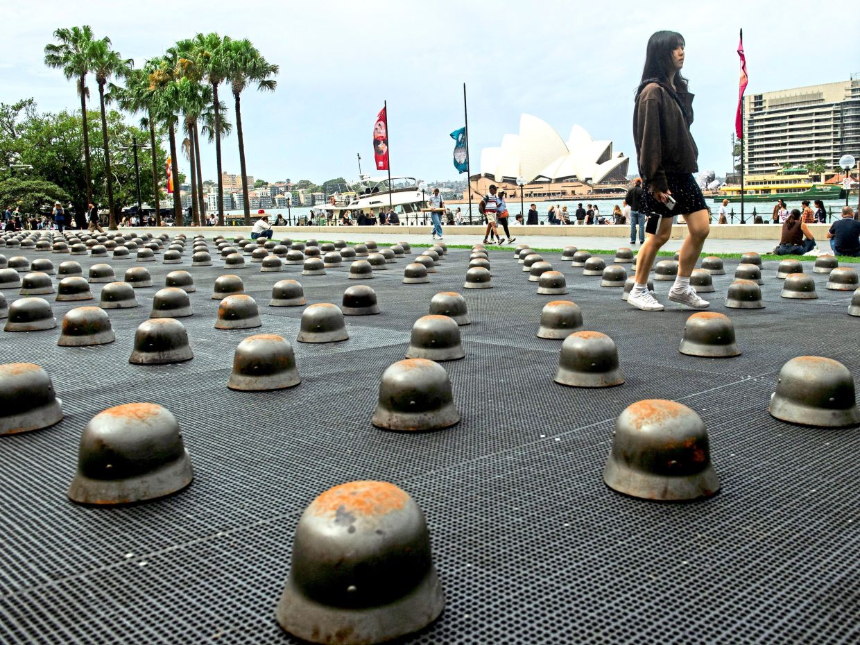 3. A woman walking past sculptures by artist Ai Weiwei, titled ‘Mushrooms’, at the Museum of Contemporary Art Australia in Sydney. The work reflects on conflict, resilience and the fragility of peace in the 21st century. — Reuters