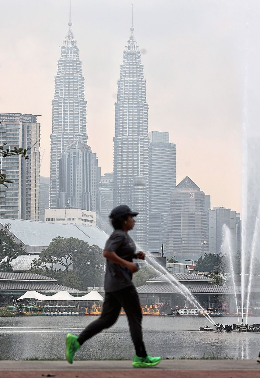 4. The Petronas Twin Towers are shrouded in haze in Kuala Lumpur. The city was ranked the world’s most polluted major city on Sept 30, according to Swiss air-quality monitor IQAir, with an AQI reading of 166. — MUHAMAD SHAHRIL ROSLI/The Star