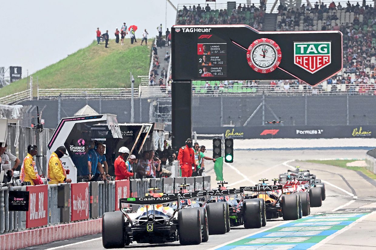 1. Drivers steering their cars out of the pit lane during the third practice session ahead of the Formula One Bahrain Grand Prix at Sepang. Malaysia is hosting the race this year due to the conflict in the Middle East. — AFP