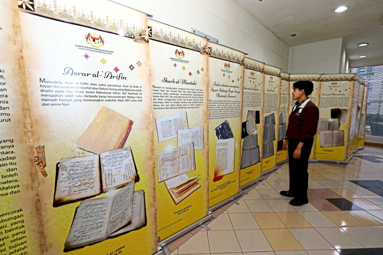 A visitor checks out the exhibition highlighting notable Malay manuscripts at the National Centre for Malay Manuscripts on the 11th floor of the National Library.