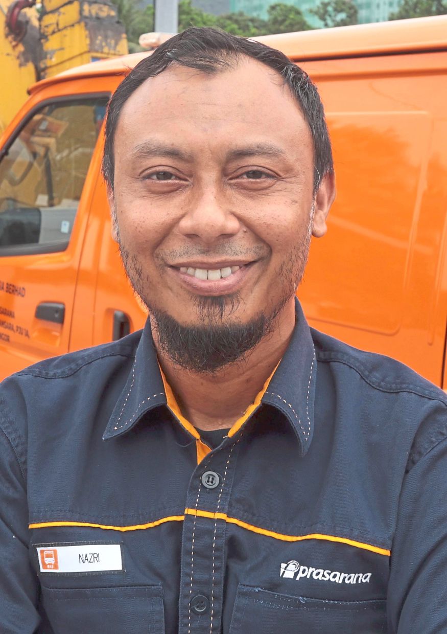 Nazri serves as technician, tow-truck driver and rescue team member.