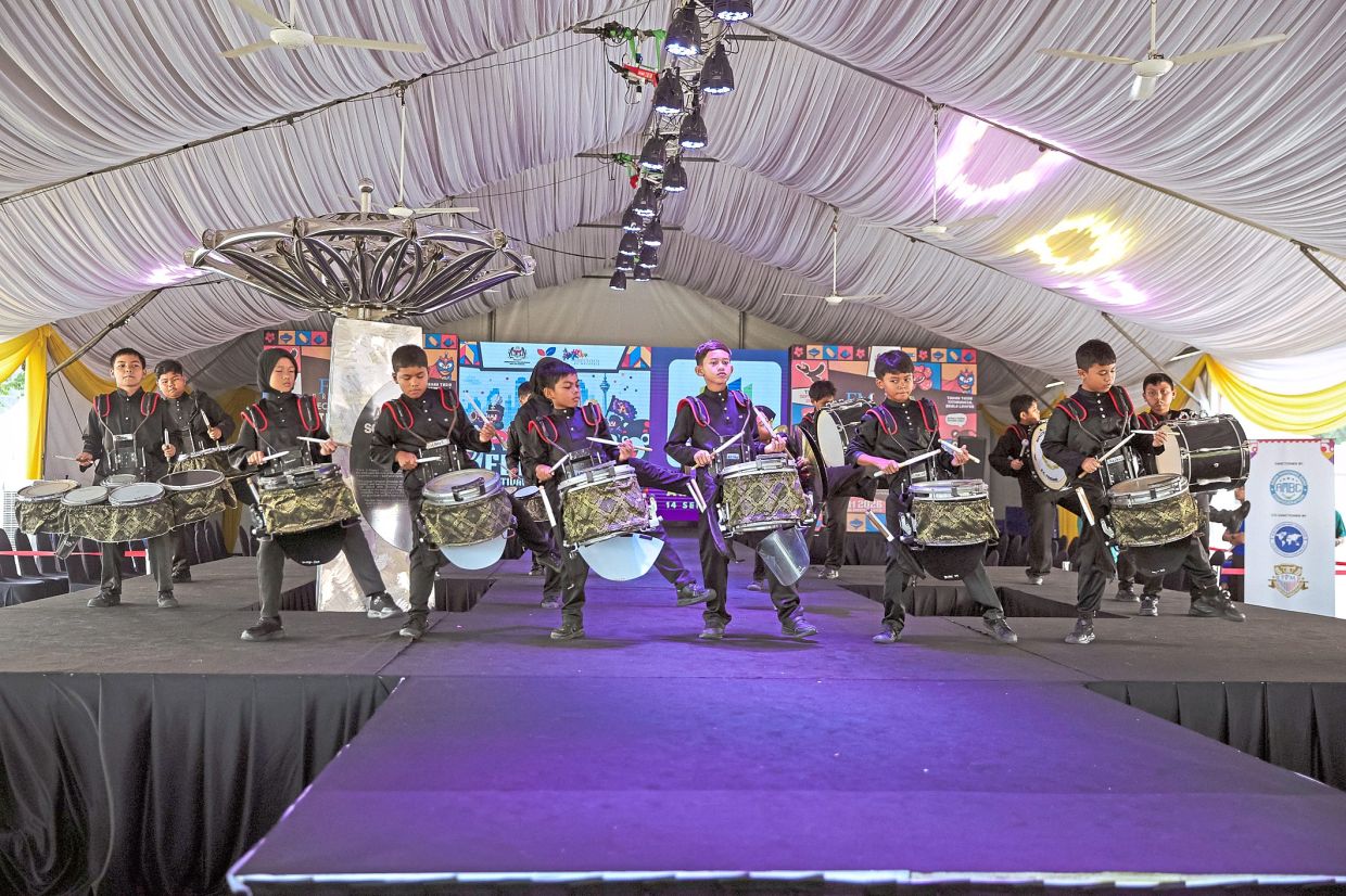 Above: The team from SK Pendang performing at the Marching Band Uniform Couture showcase during the Malaysian Marching Band Festival held at Taman Tasik Titiwangsa, Kuala Lumpur.