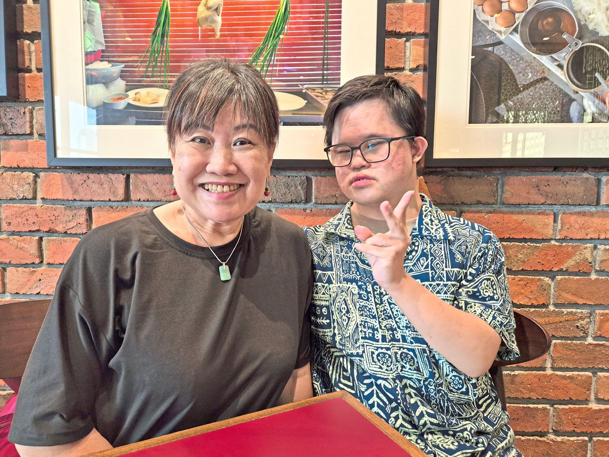 Chan (left) with Lee, whom she is preparing for a more independent future. Photo: The Star/Sheela Chandran
