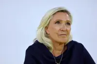 Le Pen eyes bond markets with promise of bigger spending cuts if far right wins presidency