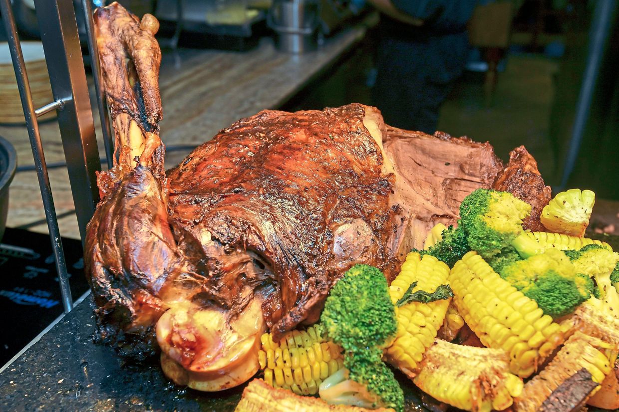 Slow-roasted Australian lambleg with gremolata and fig (right).