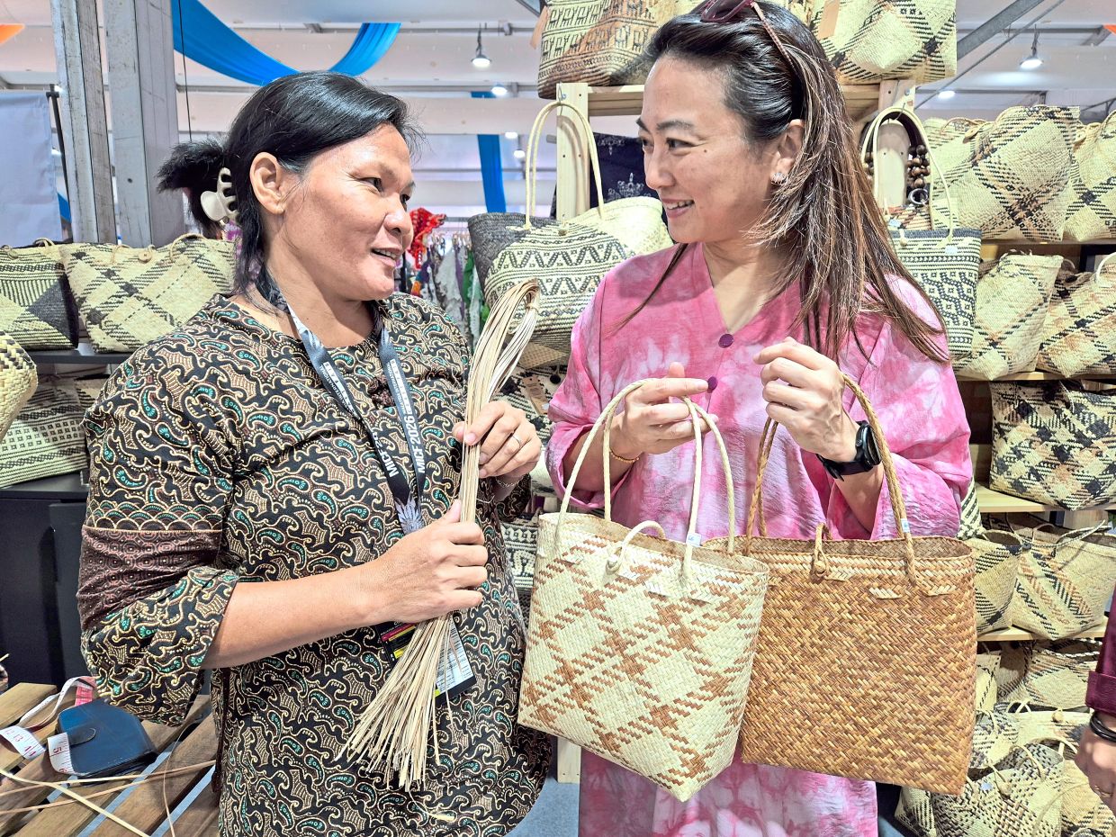 Yeoh (right) chatting with Helen during her visit to MICF 2026.