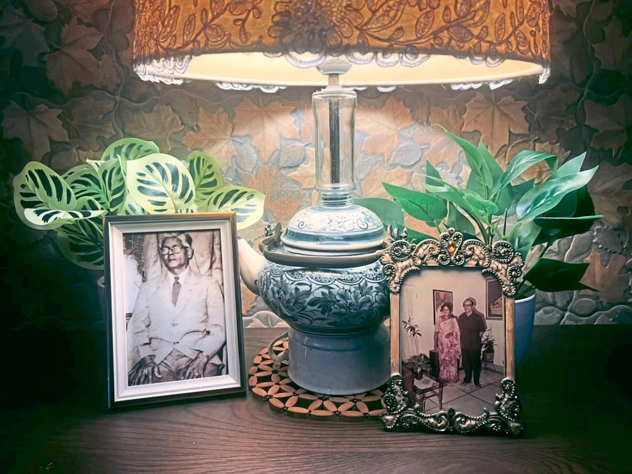 The exhibition brings family photographs into a public space, inviting visitors to look at them as part of Malaysia's social history.