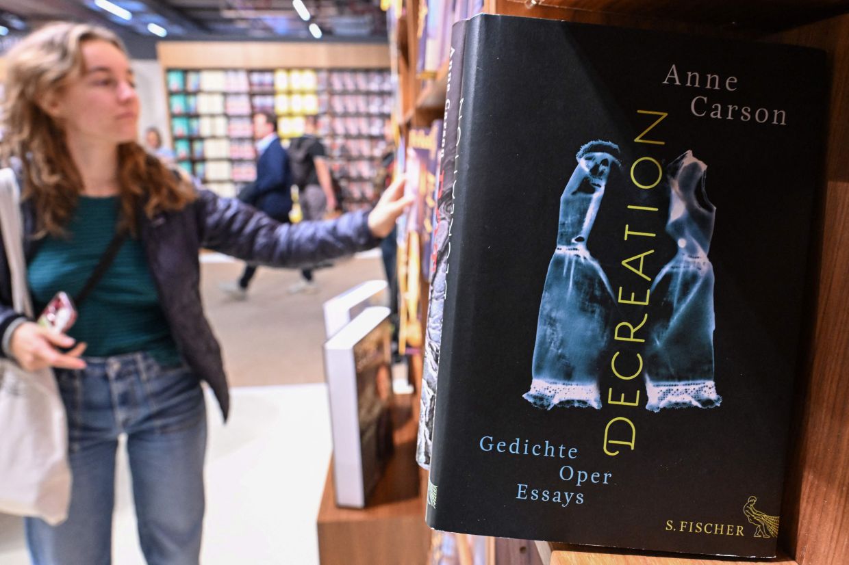 Books of 2026 Nobel Prize in Literature laureate Carson are pictured on the S. Fischer publishing house booth at the 78th Frankfurt book fair in Frankfurt, Germany on Oct 8. Photo: AFP