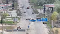People in Russian-occupied Ukrainian town risk 'road of death' to get food
