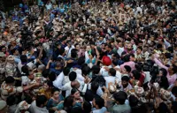 Indian opposition protest police action against lawmakers, push for poll chief's resignation