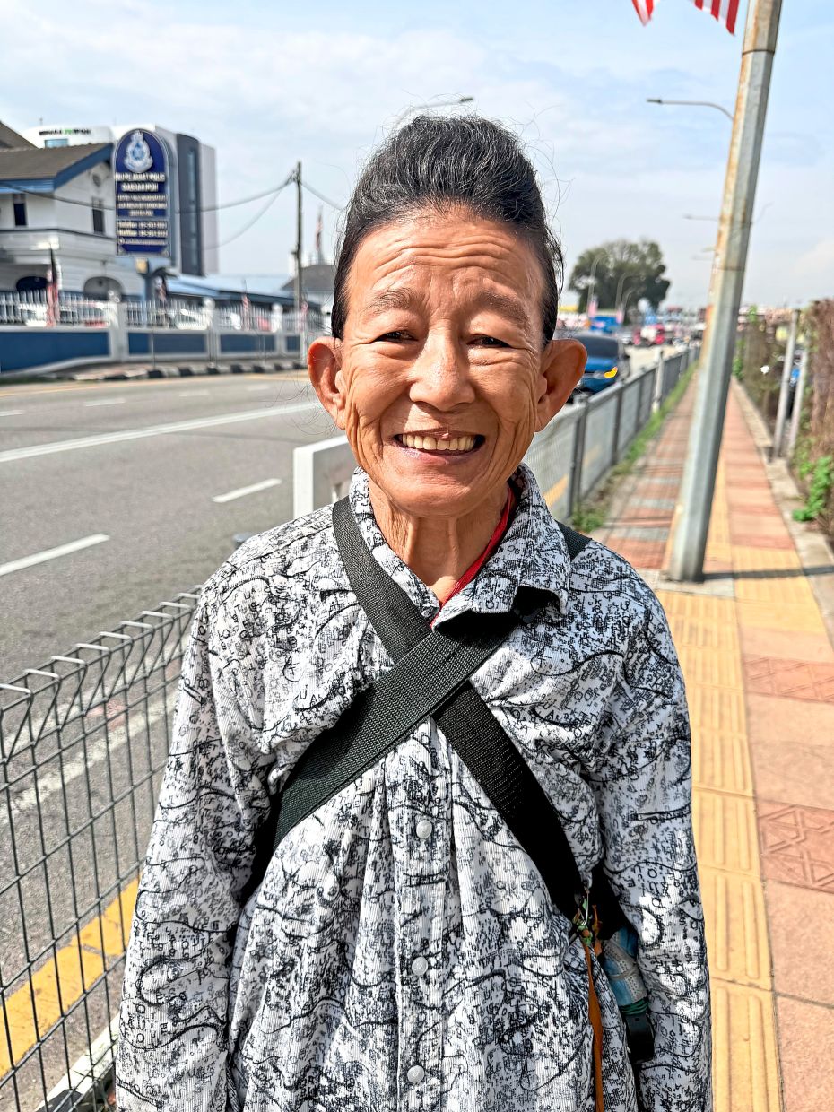 Lian Hua says pedestrians have to avoid holes on the pavement as one wrong step can cause a fall.