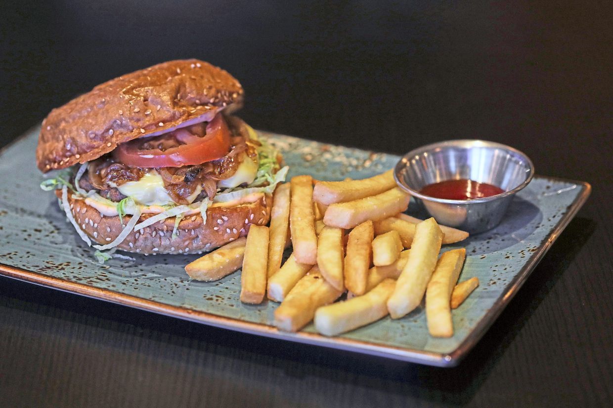 Smashed lamb burger with a perfectly seared patty in a soft, toasted bun.