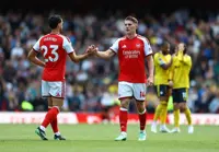 Soccer-Arteta's Arsenal survive scare to see off feisty Leeds
