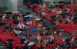 Motor racing-Singapore sprint delayed due to heavy rain