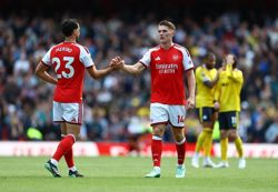 Soccer-Arteta's Arsenal survive scare to see off feisty Leeds