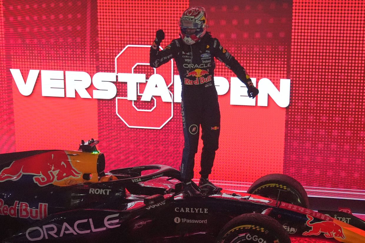 Red Bull driver Max Verstappen of the Netherlands celebrates after winning the Singapore Formula One Grand Prix race in Singapore on Sunday, Oct. 11, 2026. -- AP Photo/Ng Han Guan