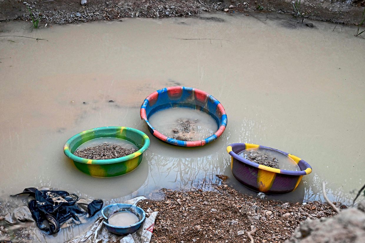 An abandoned illegal gold mining site in the village of Baziafla near Bouafle. — AFP