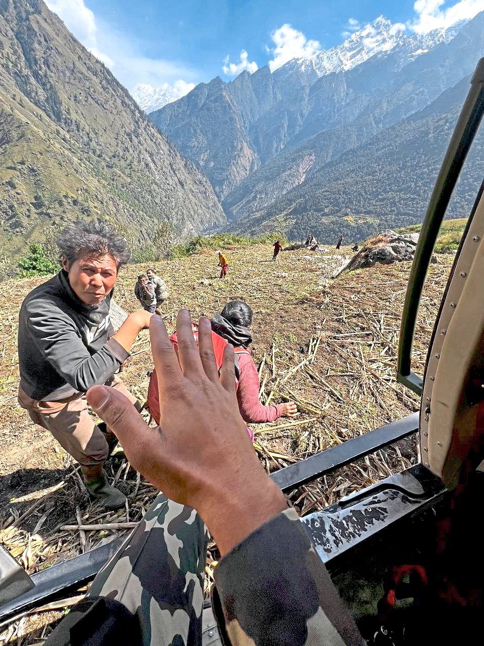 Army helicopter rescuing people from areas affected by Budhi Gandaki River flooding after a landslide in Chumnubri, Gorkha district. — AP