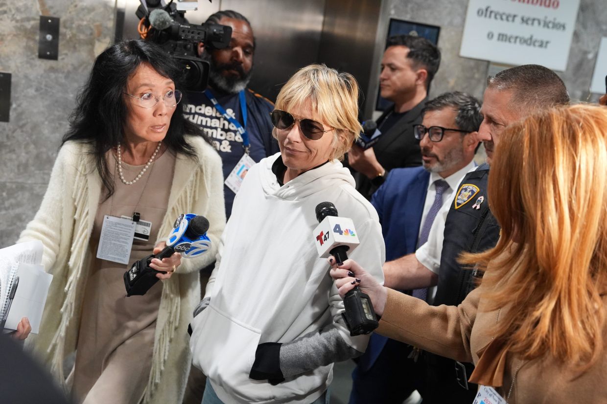 Selma Blair leaves court on Monday, Oct. 12, 2026, in New York after her arraignment on charges of injuring two flight attendants during a cross-country flight. Photo: AP