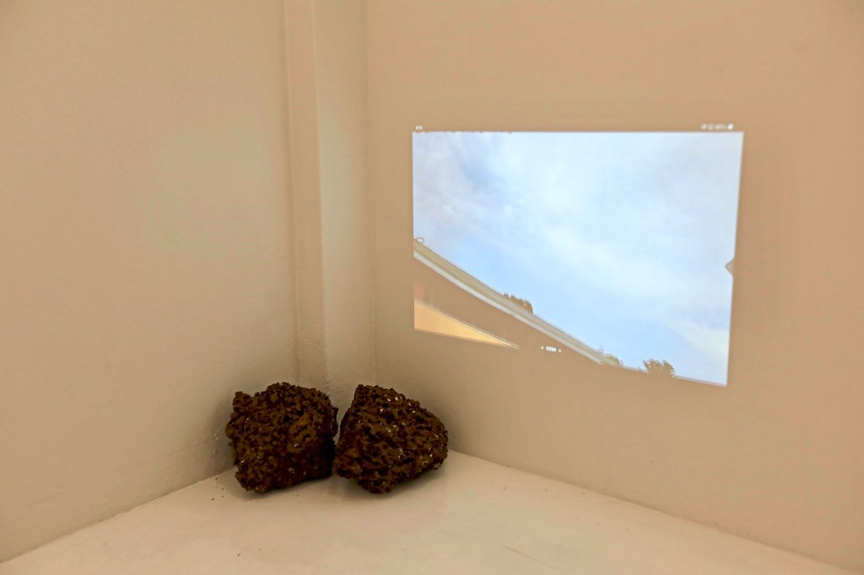 The exhibition includes a live feed of an oil refinery’s flare stack that can be seen from Chin’s home in Port Dickson.