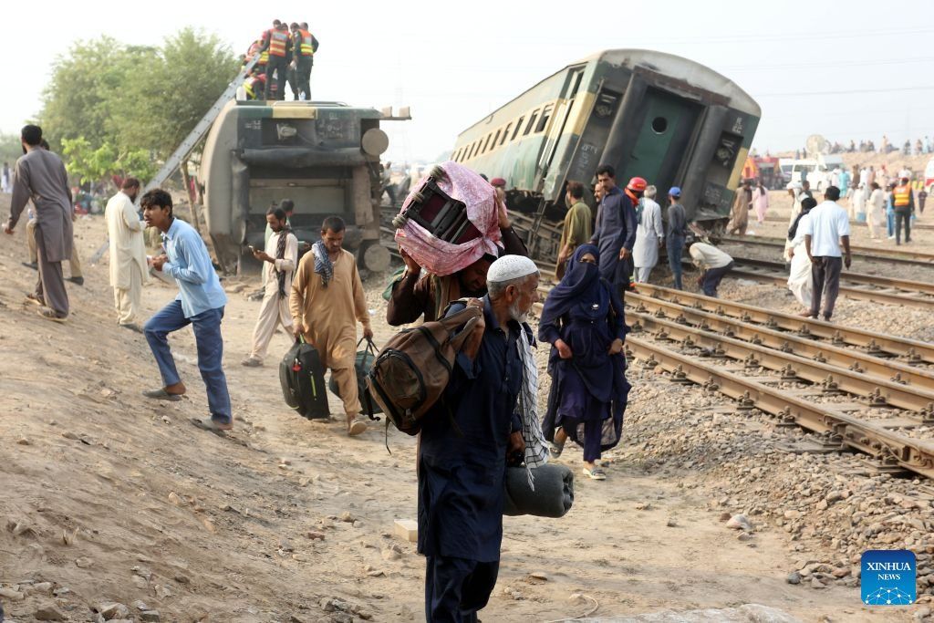 People are evacuated from the site of a train derailment accident in Multan district of Punjab province, Pakistan, Oct 13, 2026. - Photo: Xinhua