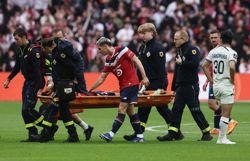 Soccer-Lille consider legal action after defender suffers ruptured ACL in tackle