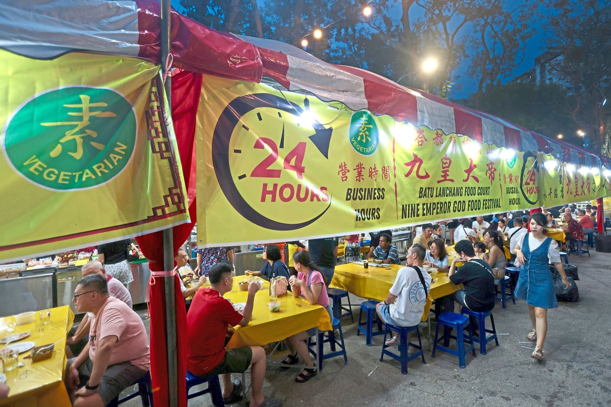 A Nine Emperor Gods Festival food fair sprouting up beside the Batu Lanchang market in Jelutong, George Town.