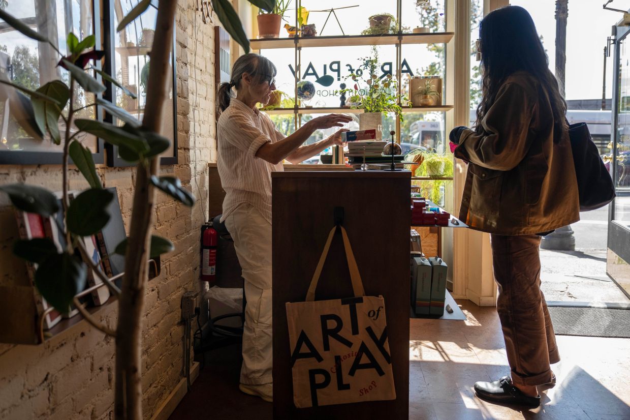 A customer purchases items at Art of Play, Tuesday, Oct 13, 2026, in the Brooklyn borough of New York. Photo: AP