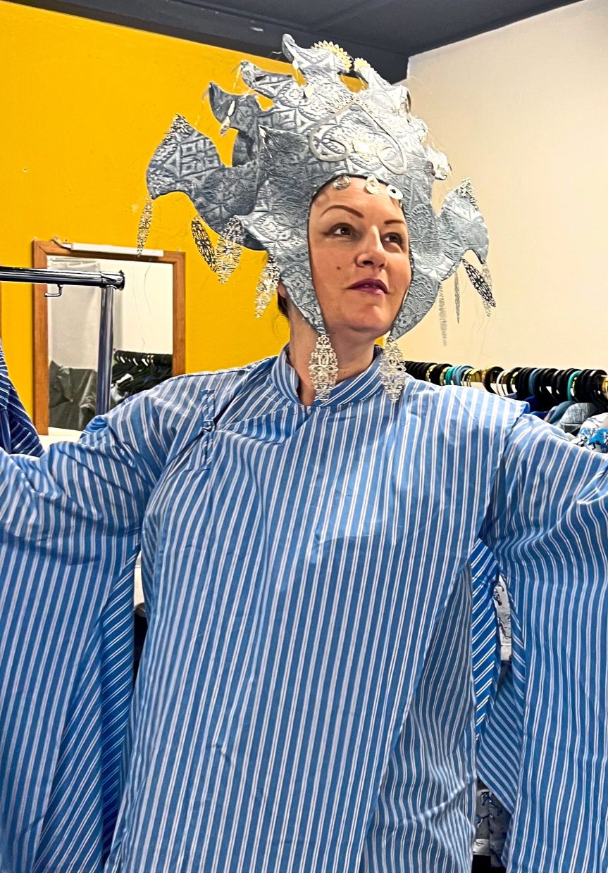 Soprano Eleanor Greenwood dons Turandot's iconic headdress in a costume fitting. Photo: KLCO