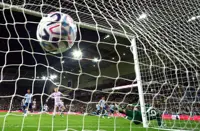 Soccer-English football 'dangerously exposed' to financial risk, regulator finds
