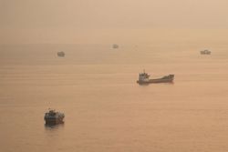 Two Singapore-registered vessels hit in the Strait of Hormuz, one sinks