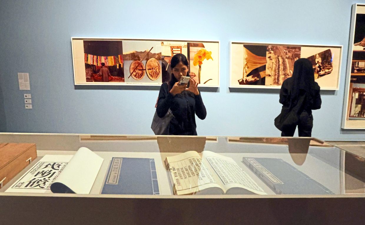 Rauschenberg photographed extensively with colour film during a 1982 sojourn in China. He used this material for his first and only project involving chromogenic prints. This ROCI China series (1984) is titled 'Studies For Chinese Summerhall', featured on the wall. Photo: The Star/Chan Tak Kong