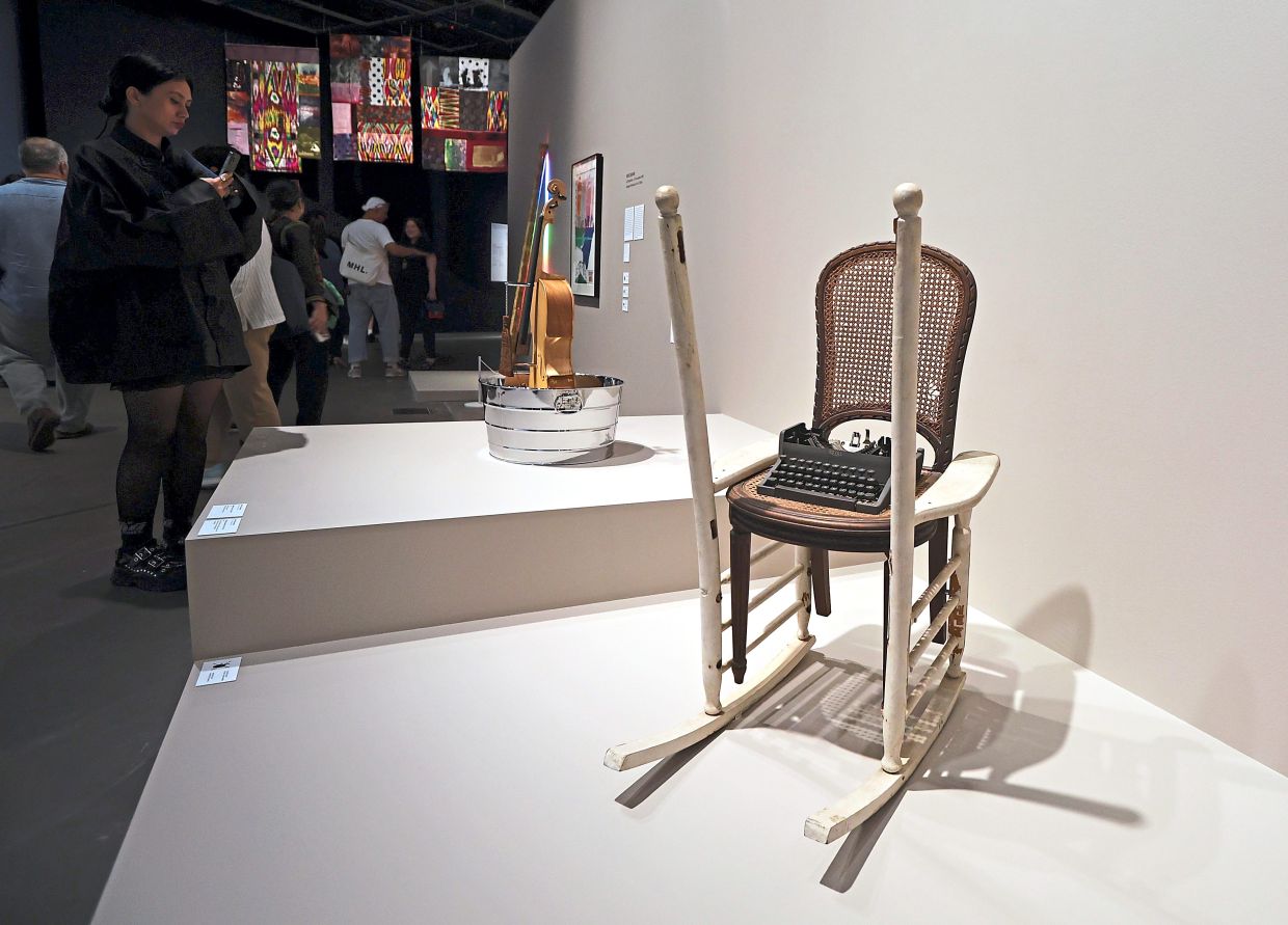 Rauschenberg's 'Magnetic Strip' (chairs and typewriter, 1985), front, and 'Tibetan Garden Song' (cello, tub, glycerin, brush and mirrored Plexiglass, 1986). These works were part of the ROCI Tibet trip. Photo: The Star/Chan Tak Kong