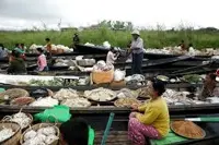 Centuries-old floating market on Myanmar's Inle Lake offers fresh groceries from boats