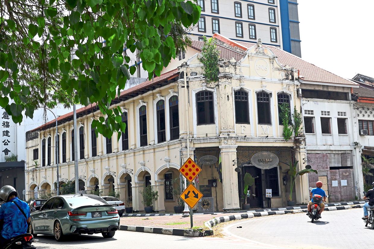 The second floor of this pre-war building on Jalan Sultan Idris Shah in Ipoh is vacant and has plants taking root.