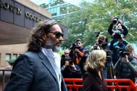 'Wild-eyed' comedian Russell Brand tried to drag me into toilets, woman tells UK court