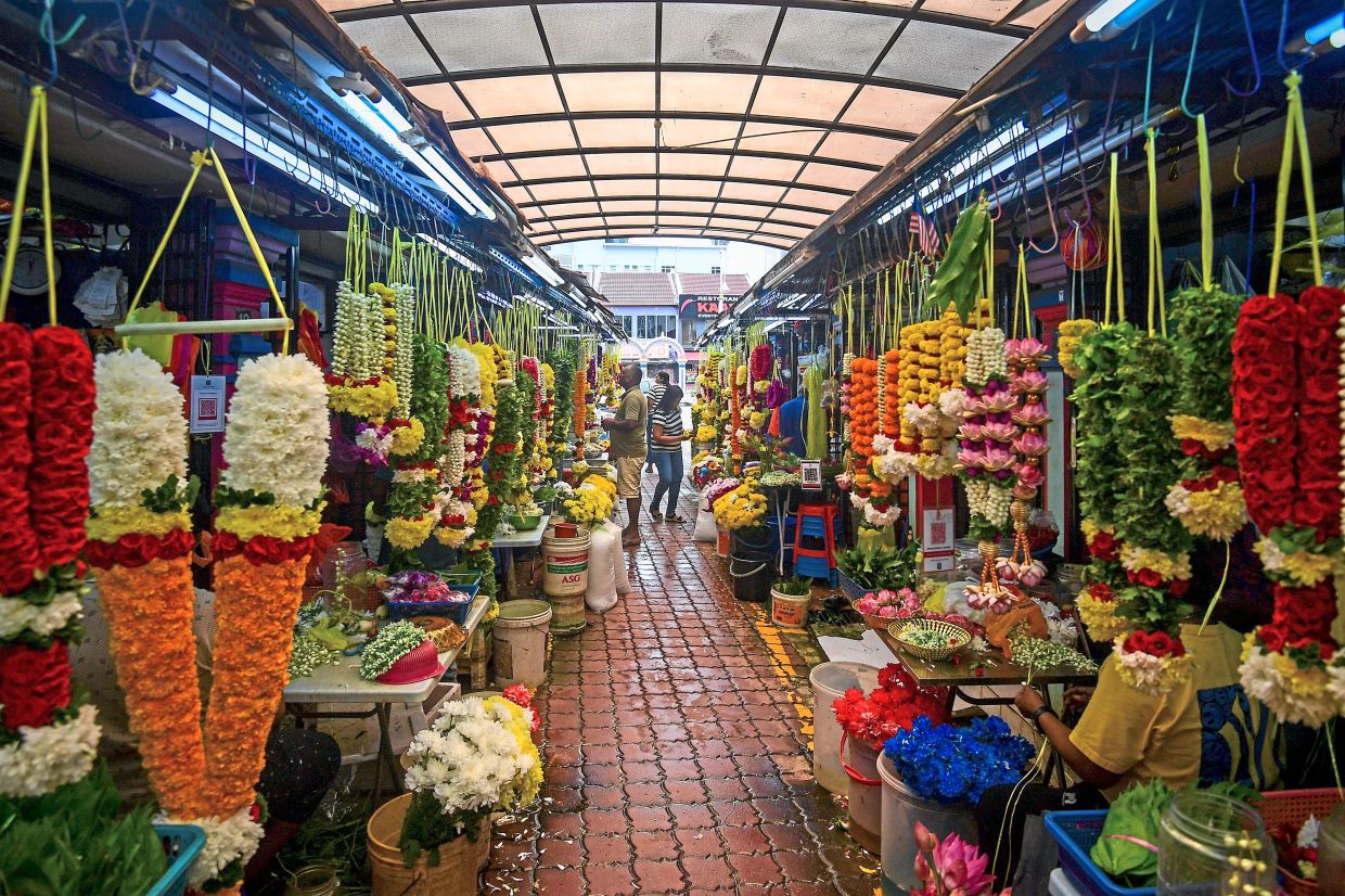 Elaborate, brightly coloured flower garlands for prayers being sold in Brickfields, Kuala Lumpur, as Deepavali preparations ramp up. — EZARD FAROUQ/The Star