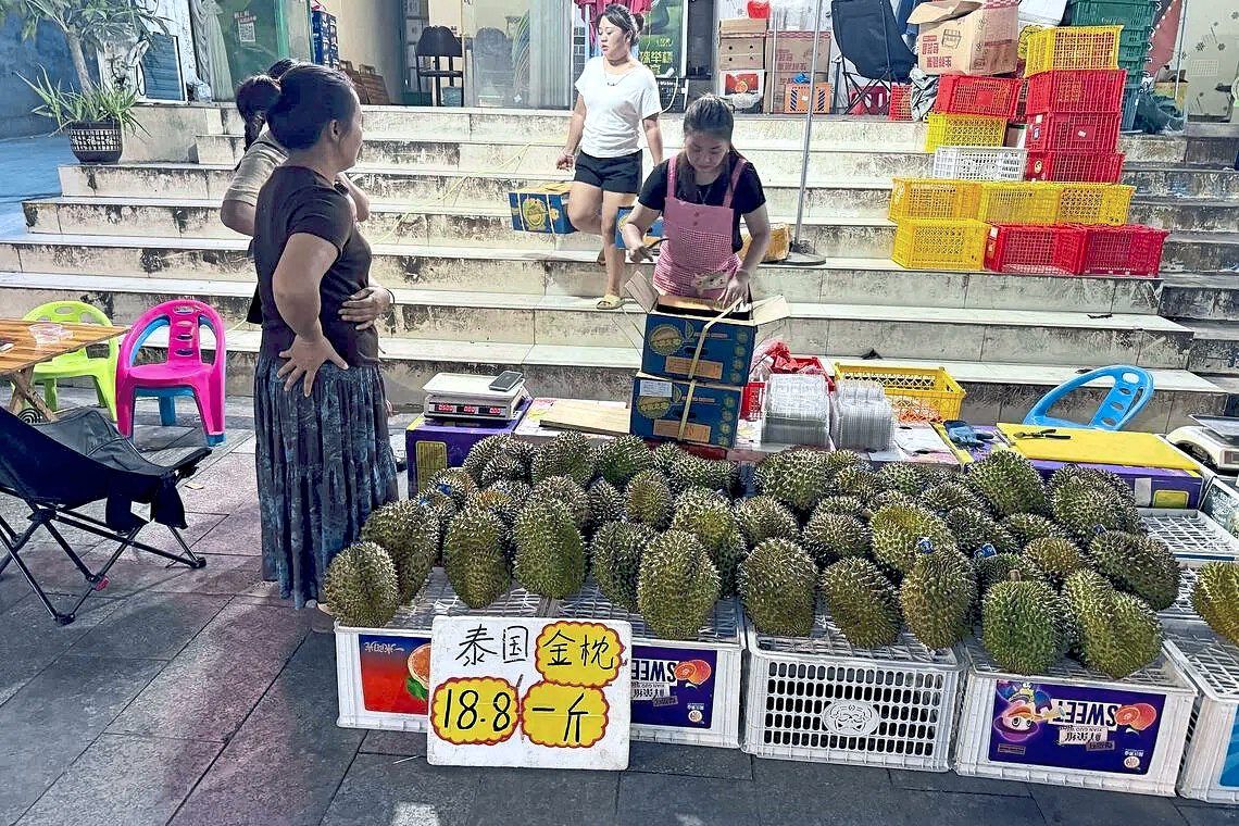 Thai durians being sold on a street in Pingxiang, China. — Photos: JOYCE ZK LIM/The Straits Times/ANN
