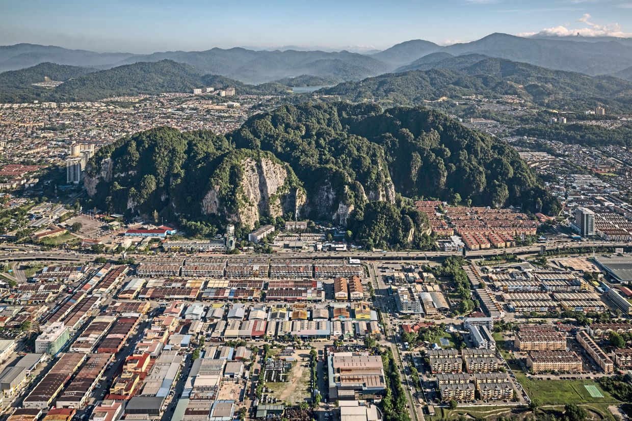 The limestone karst of Batu Caves features prominently in the developed flatlands of Gombak. Photo: Ian Teh