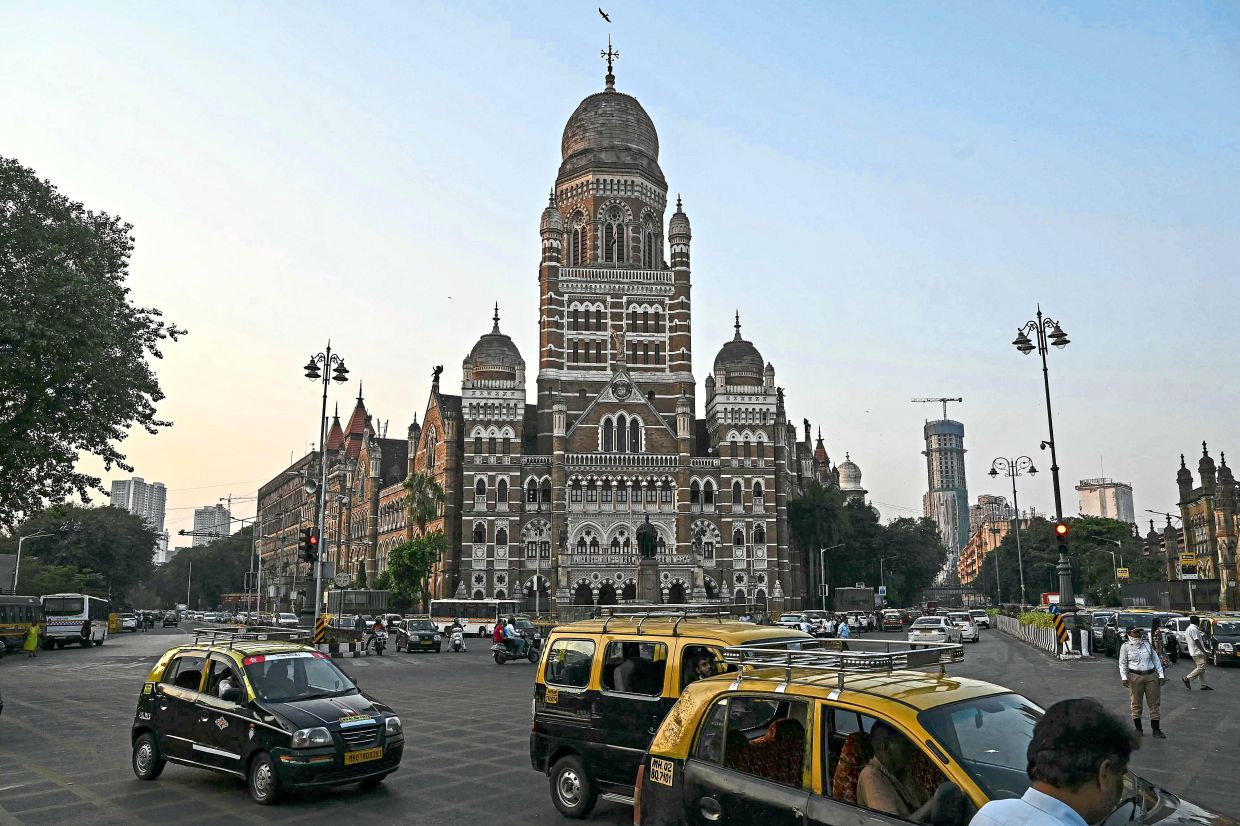 Vehicles drive past the Brihanmumbai Municipal Corporation (BMC) building in Mumbai. Photo: AFP