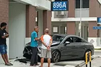 Car skids, crashes into wall at Singapore's Tampines HDB block