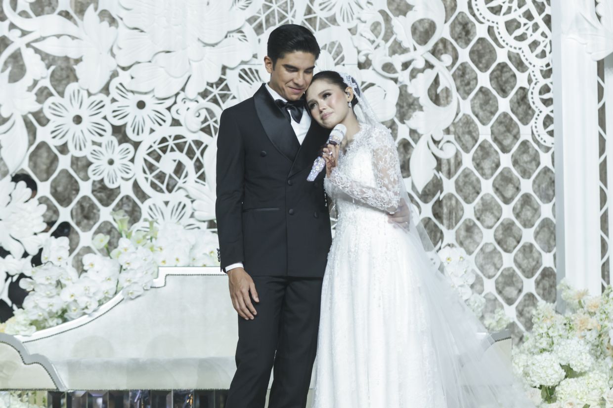 Bella and Syed Saddiq are scheduled to hold two more receptions, which will be open to the public, later this month.