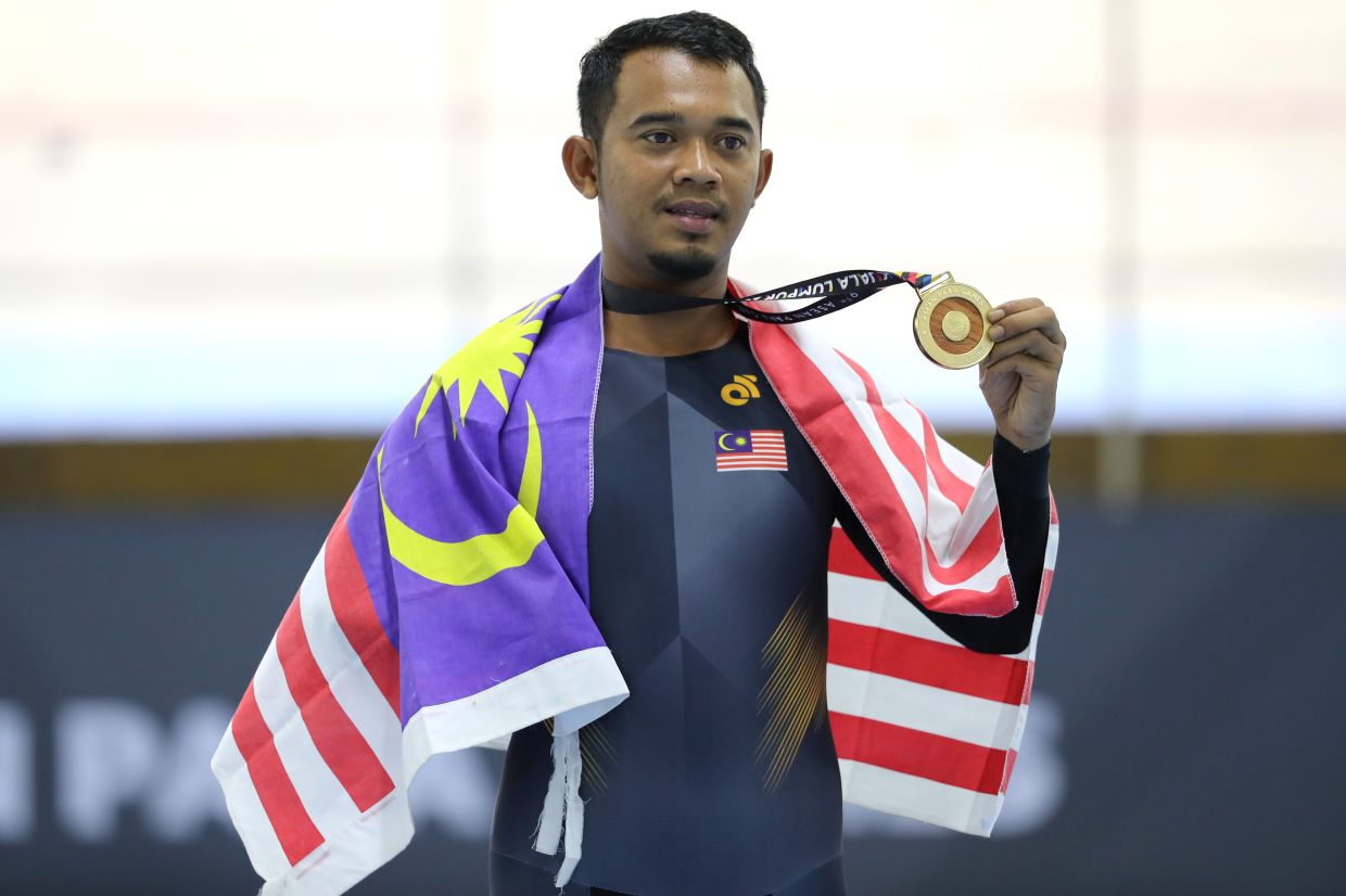 Cyclist Zuhairie rides to Malaysia's first gold at Asian Para Games in ...