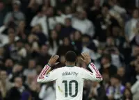 Soccer-Mbappe double helps Real Madrid sweep aside Sevilla ahead of El Clasico