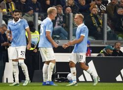 Soccer-Danish duo fire high-flying Lazio to 3-0 win over Juventus