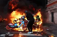 Bonfires of electric bikes burn in Paris riots