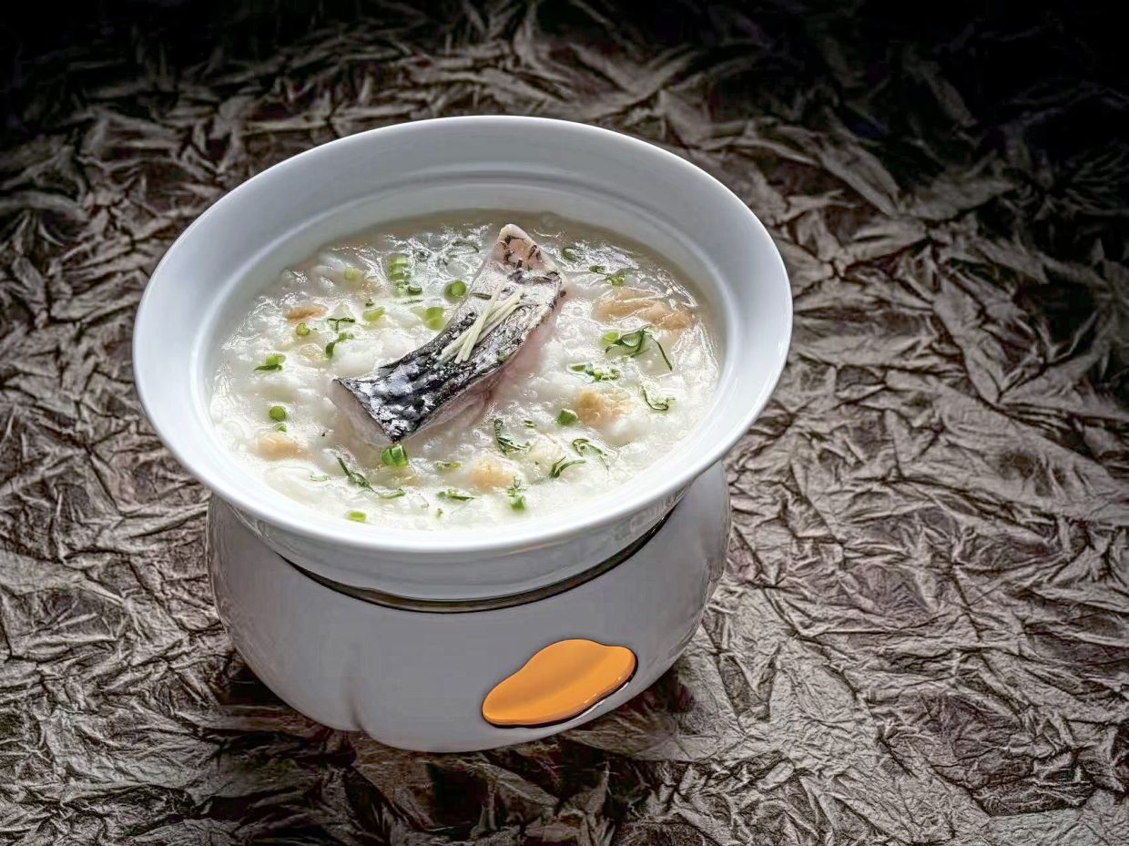 The crucian carp congee features a notoriously bony fish and is a Teochew classic that Fei makes to perfection. — Mandarin Oriental Guangzhou