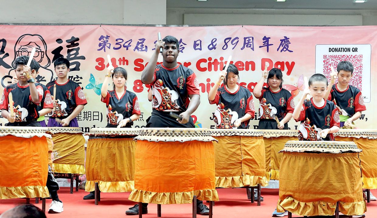 Youths delivering a 24-festive drum performance.